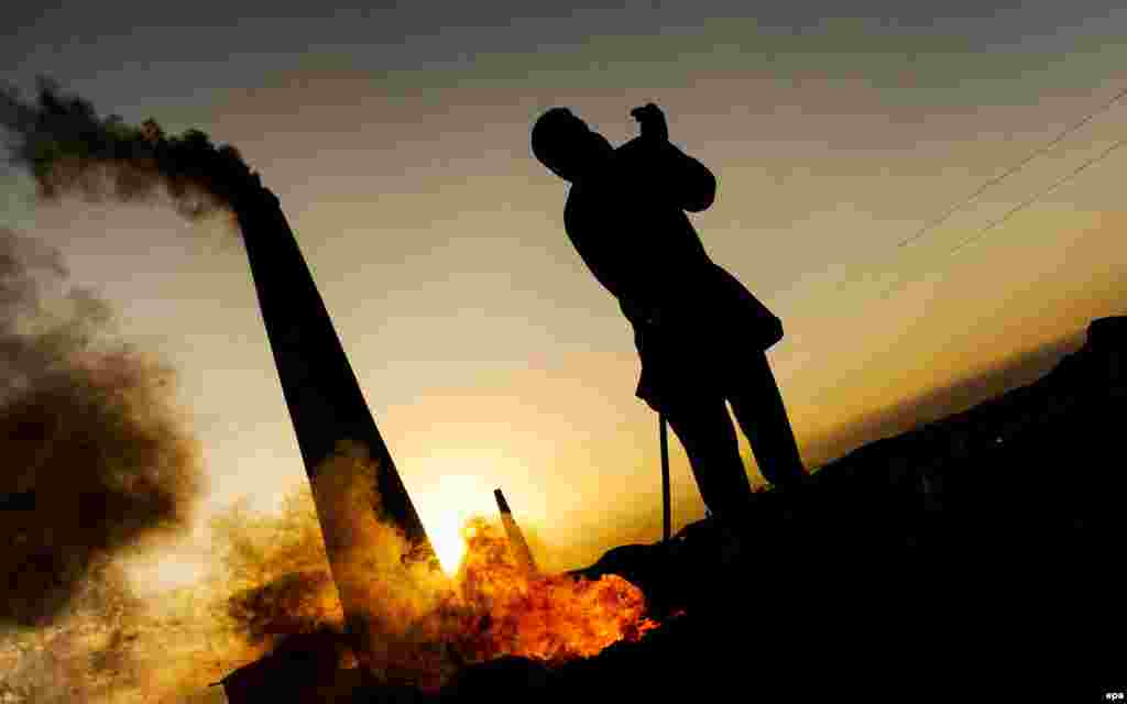 An Afghan laborer works at a brick kiln on the outskirts of Kabul. (EPA/Jawad Jalali)