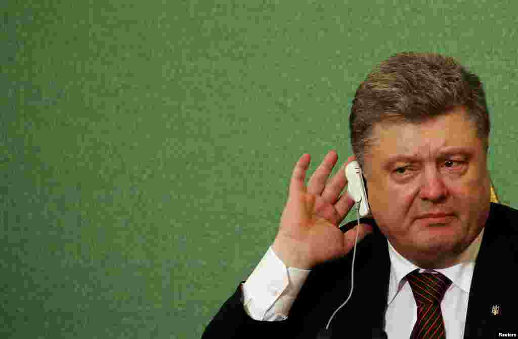 Ukrainian President Petro Poroshenko gestures during a news conference at the Japan National Press Club in Tokyo on April 6. (Reuters/Thomas Peter)