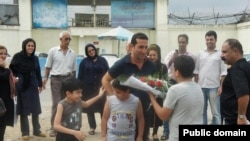 Iranian pastor Youcef Nadarkhani meets his family upon being released from prison on September 8.