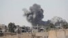 Smoke rises at the positions of Islamic State militants after an air strike by U.S.-led coalition forces at the front line in Raqqa, Syria, on October 5.