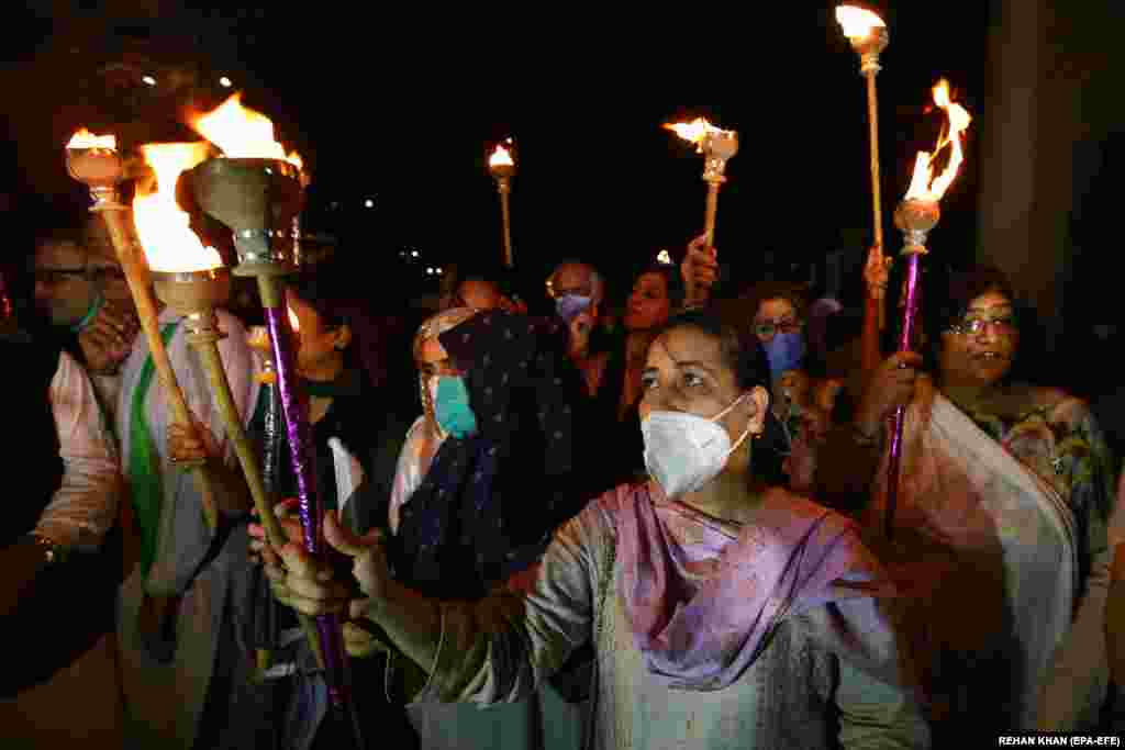 People also carried torches in Karachi as they marked the country's 73rd anniversary.