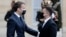 French President Emmanuel Macron (left) welcomes Ukrainian President Volodymyr Zelenskiy at the Elysee Palace in Paris on April 16.