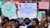 Supporters of Khalid Khan, the man who killed Tahir Nasim, who was in court on blasphemy charges, protest in Peshawar on July 31.