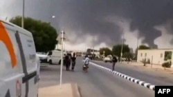 Clouds of smoke rise after strikes on a refinery in the Saudi city of Jizan, which was claimed by Yemen's Iran-backed Houthi rebels in late July.