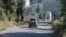 We walked some 20 kilometers to the Donetsk city of Bilozerske, guided by Fara, a soldier from the Rubizh Brigade of Ukraine's National Guard. Walking is often favored over driving near the front lines due to the danger of drones, which are harder to detect and evade in a vehicle.<br>