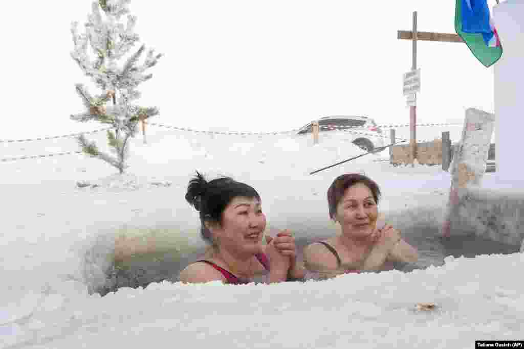 Women bathe in the Lena River as the temperature dropped to about minus 56 degrees Celsius in Yakutsk, Russia.