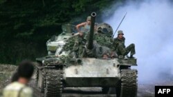 Abkhaz soldiers outside the town of Chkhalta in August 2008. Negotiators are set to discuss security in the wake of the Russia-Georgia war. 