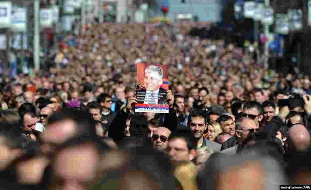 More than 15,000 people marched in silence in Belgrade on March 12 to mark the 10th anniversary of Djindjic's assassination. (AFP/Andrej Isakovic)
