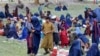 Afghan women and children take refuge after fleeing their homes in the aftermath of an earthquake in Kunar Province on September 3.