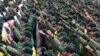 FILE: Members of the Iranian Revolutionary Guard raise their fists while shouting slogans during a ceremony marking the 40th anniversary of the 1979 Islamic Revolution, at the Azadi (Freedom) square in Tehran on February 11 2019.