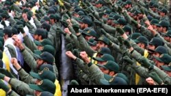 FILE: Members of the Iranian Revolutionary Guard raise their fists while shouting slogans during a ceremony marking the 40th anniversary of the 1979 Islamic Revolution, at the Azadi (Freedom) square in Tehran on February 11 2019.