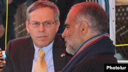 Armenia - U.S. Ambassador John Heffern (L) visits opposition leader Raffi Hovannisian in Liberty Square in Yerevan, 22Mar2013.