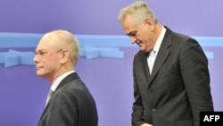 European Union Council President Herman Van Rompuy (left) walks alongside the newly elected president of Serbia, Tomislav Nikolic, prior to a working session at the EU Headquarters in Brussels on June 14.