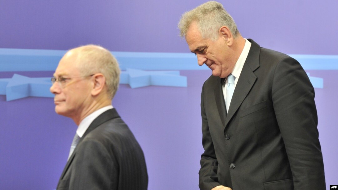 European Union Council President Herman Van Rompuy (left) walks alongside the newly elected president of Serbia, Tomislav Nikolic, prior to a working session at the EU Headquarters in Brussels on June 14.