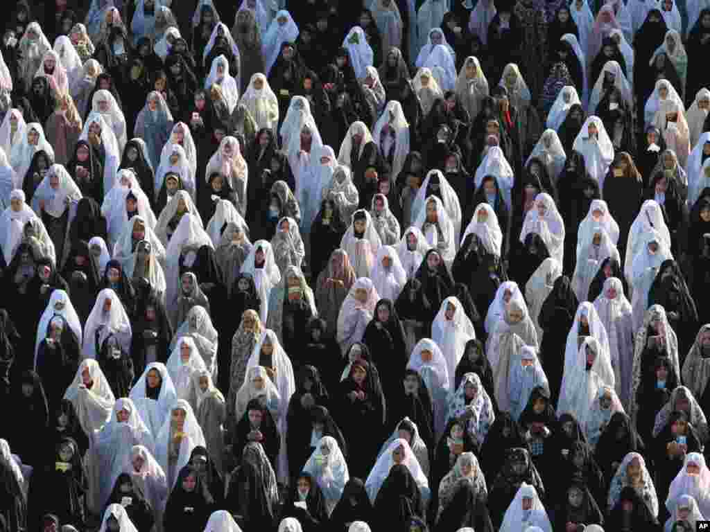 Women perform their Eid al-Fitr prayer on Imam Square in the Iranian city of Isfahan. (Photo by Vahid Salemi for AP)