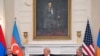 US President Donald Trump (C), Azerbaijani President Ilham Aliyev (L) and Armenian Prime Minister Nikol Pashinyan react after signing an agreement in the State Dining Room of the White House in Washington, DC on August 8, 2025.
