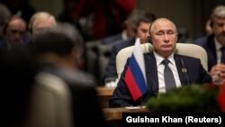 Russian President Vladimir Putin looks on during the BRICS summit in Johannesburg on July 26.