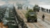 Troops transport trucks on a pontoon bridge across a river during joint military exercises held by Russia and Belarus in September.