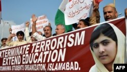 Pakistan -- Demonstrators chant slogans during a protest against the assassination attempt by the Taliban on child activist Malala Yousafzai in Islamabad, 16Oct2012