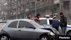 Armenia -- Traffic police investigate a car collision in Yerevan, 11Jan2011.