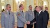Владимир Путин жмет руку главе Росгвардии Виктору Золотову во время встречи в Кремле, 25 октября 2018 года