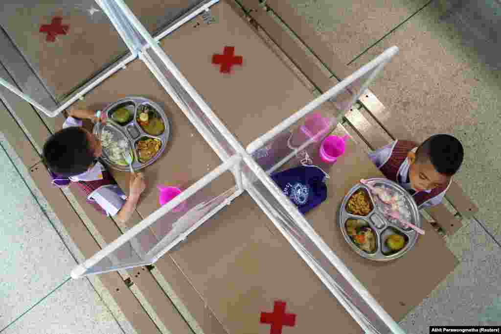 Kindergarten students in Bangkok at a trial of lunch seating on June 23, ahead of schools reopening in Thailand.