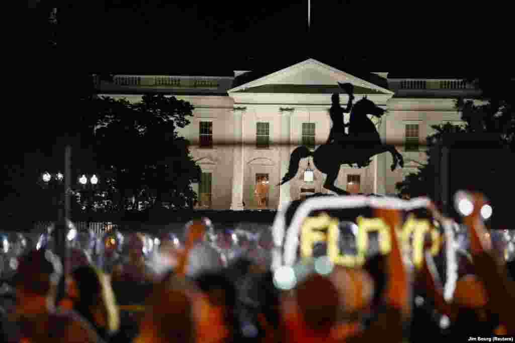 Demonstrators gather along the fence surrounding Lafayette Park outside the White House as protests continue over the death in police custody of George Floyd, in Washington, U.S., June 2, 2020. REUTERS/Jim Bourg