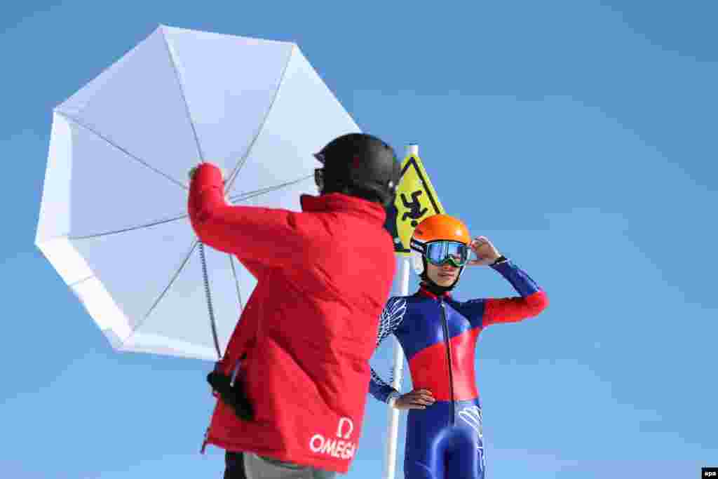 Violinist Vanessa-Mae Vanakorn (Vanessa Mae), who is skiiing for Thailand at the games, poses during a photo shoot near the Rosa Khutor Alpine Center.