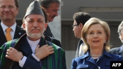 Afghan President Hamid Karzai (left) and U.S. Secretary of State Hillary Clinton (file photo)