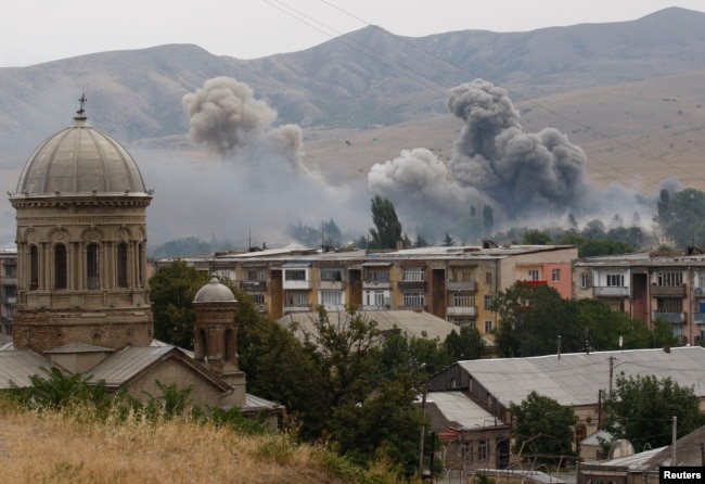 Smoke is seen over buildings after a Russian bombardment of Gori, 80 kilometers from Tbilisi, on August 9, 2008.