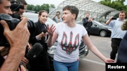 Nadia Savchenko talks to the media at Boryspil International airport outside Kyiv on May 25 after being released from imprisonment in Russia.
