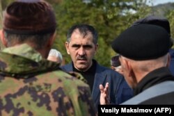 Ingushetian leader Yunus-Bek Yevkurov meets with the locals in the mountain village of Dattykh near the new border line between Chechnya and Ingushetia on October 10.