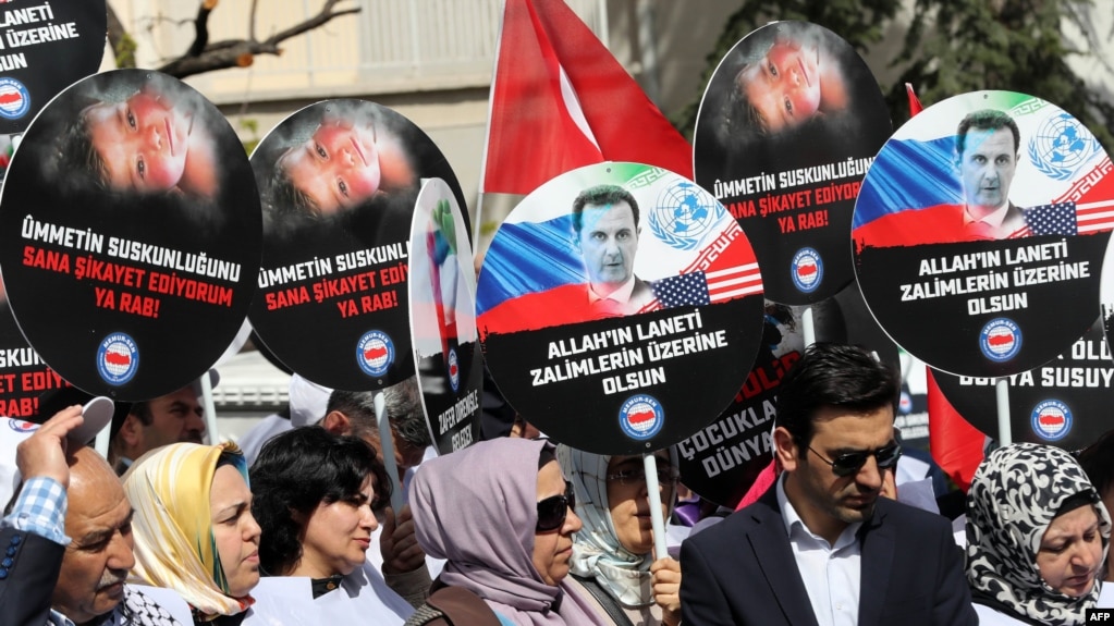 People protest against Russia for its alleged role in a chemical attack in the Syrian province of Idlib, in front of the Russian Embassy, in Ankara, on April 7.