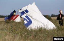 Wreckage at the crash site of Malaysia Airlines Flight 17 on July 26, 2014