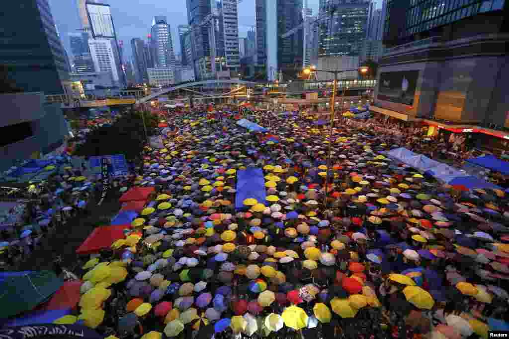 Protesters in Hong Kong open their umbrellas, symbols of the prodemocracy movement, as they mark one month since the beginning of mass demonstrations demanding reform. (Damir Sagolj, Reuters)