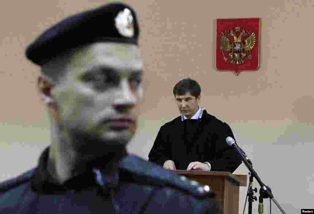 Judge Sergei Blinov reads the verdict during the hearing in Kirov.