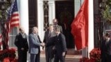 U.S. -- NEW YORK -- General Secretary of the Central Committee of the Communist Party of the USSR Mikhail Gorbachev (second from left) shakes hands with Vice President of the United States George Bush as President of the United States Ronald Reagan stands