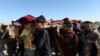 Afghan mourners carry the coffin of one of the victims of a U.S. air strike in the Achin district of Nangarhar province on January 12