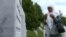 Bosnia and Herzegovina - Mejra Djogaz from Srebrenica visits the graves of her sons every day in Potocari Memorial Center. June 2021