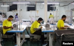 Migrants from India work at a textile factory in Balashikha, just outside Moscow, in January.