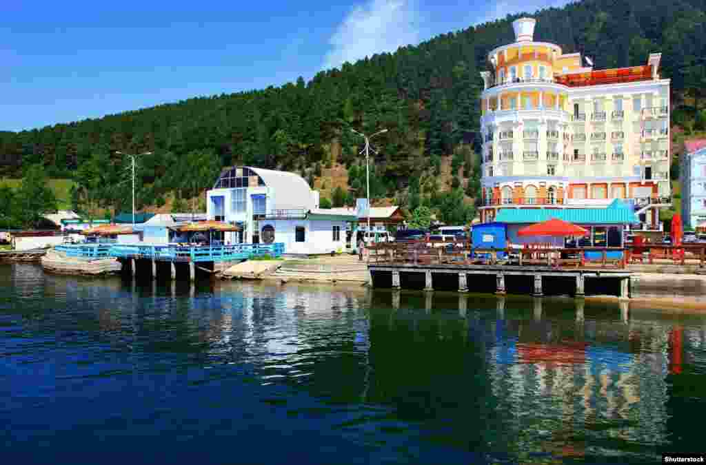 Lakeside in the tourist town of Listvyanka. The influx of foreign visitors has fueled tensions in some of the villages surrounding the lake, where massive Chinese investment is funding high-rise hotels and resorts. In 2019, the mayor of Listvyanka was charged with allowing the construction of Chinese-owned hotels on land reserved for private housing.