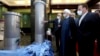  Iranian President Hassan Rohani (center) listens to Atomic Energy Organization head Ali Akbar Saleh (left) while visiting an exhibition of Iran's new nuclear achievements in Tehran.