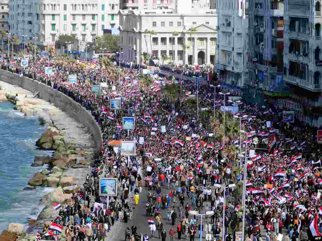 Antigovernment protesters march in the coastal city of Alexandria on February 11.