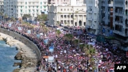Antigovernment protesters march in the coastal city of Alexandria on February 11.