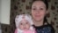 Виктория Ким, выпускница детского дома, с десятимесячной дочерью. Караганда, 18 сентября 2013 года.