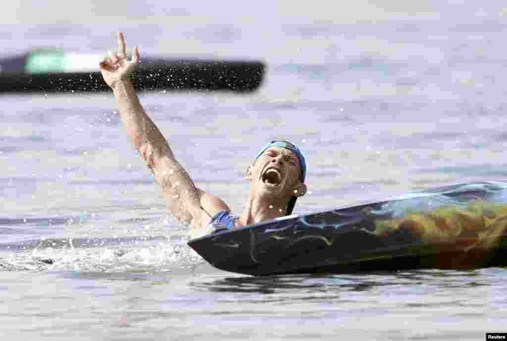 Yuriy Cheban of Ukraine roars in celebration after winning gold in the men&#39;s canoe 200-meter singles.&nbsp;