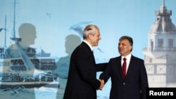 Turkish President Abdullah Gul (right) greets Serbian President Boris Tadic at the Southeast European Cooperation Process summit in Istanbul.