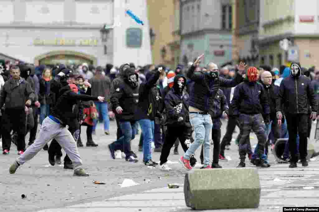 Demonstrators clash with riot police during a protest against the Czech government&#39;s restrictions, as the spread of the coronavirus disease (COVID-19) continues in Prague, Czech Republic, October 18, 2020.