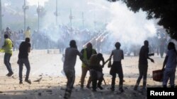 Flares are fired as Muslim Brotherhood and ousted President Muhammad Morsi supporters clash with security forces along Qasr Al Nil Bridge, which leads to Tahrir Square in Cairo, on July 22.