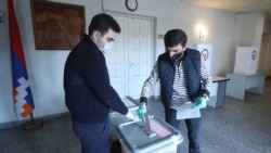 Nagorno-Karabakh -- A voter casts ballots at a polling station in Stepanakert, March 31, 2020.